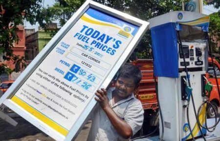 Fuel price display board at an Indian petrol pump showing petrol, diesel and CNG rates.