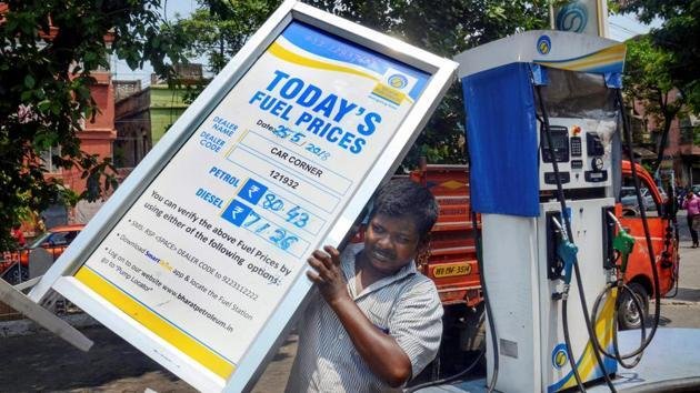 Fuel price display board at an Indian petrol pump showing petrol, diesel and CNG rates.
