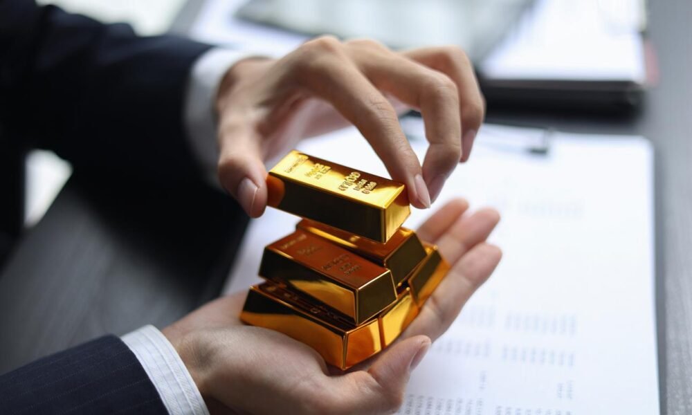 Gold bars and financial market trading visuals showing investment trends.