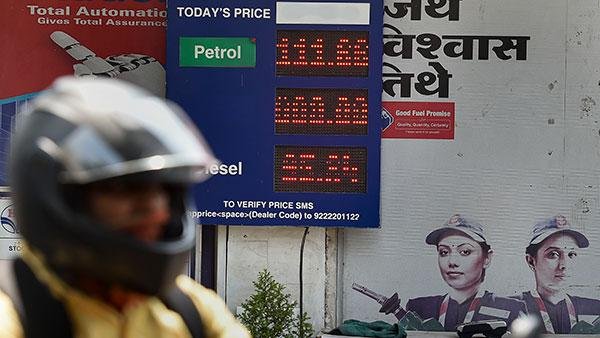 Fuel price display board at an Indian petrol pump showing petrol, diesel and CNG rates.