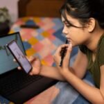 Young investors using mobile trading platforms in India
