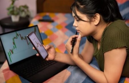 Young investors using mobile trading platforms in India