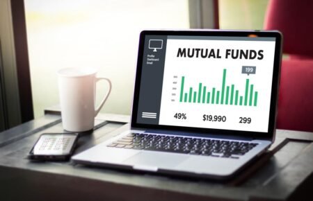 Investor reviewing mutual fund and investment portfolio performance.