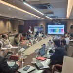 Financial professionals reviewing ESG reports and sustainability metrics.