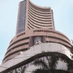 Investor monitoring stock market activity following SEBI's buyback regulation update.