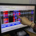 Investors monitoring Indian stock market performance during a trading session.