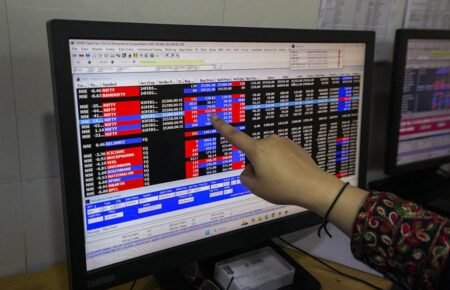 Investors monitoring Indian stock market performance during a trading session.
