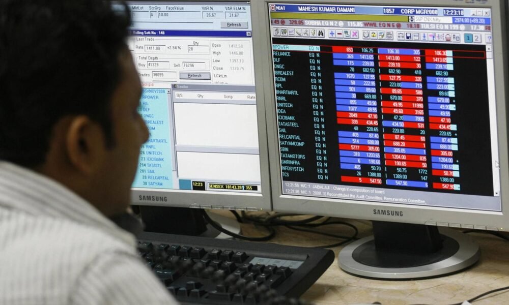 Investors tracking Indian stock market gains on trading screens.